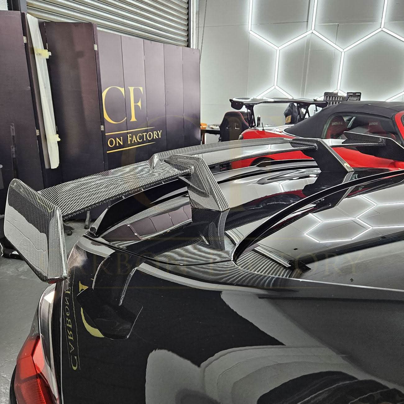 Pre-Preg Carbon fibre boot spoiler for BMW G80 M3 and G82 M4, showcasing sleek aerodynamic design and high-quality material.
