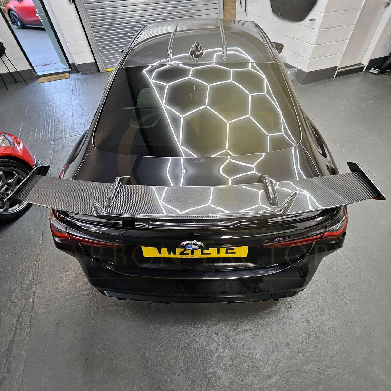 Pre-Preg carbon fiber boot spoiler for BMW G80 M3 and G82 M4, lightweight aerodynamic car accessory with sleek finish.