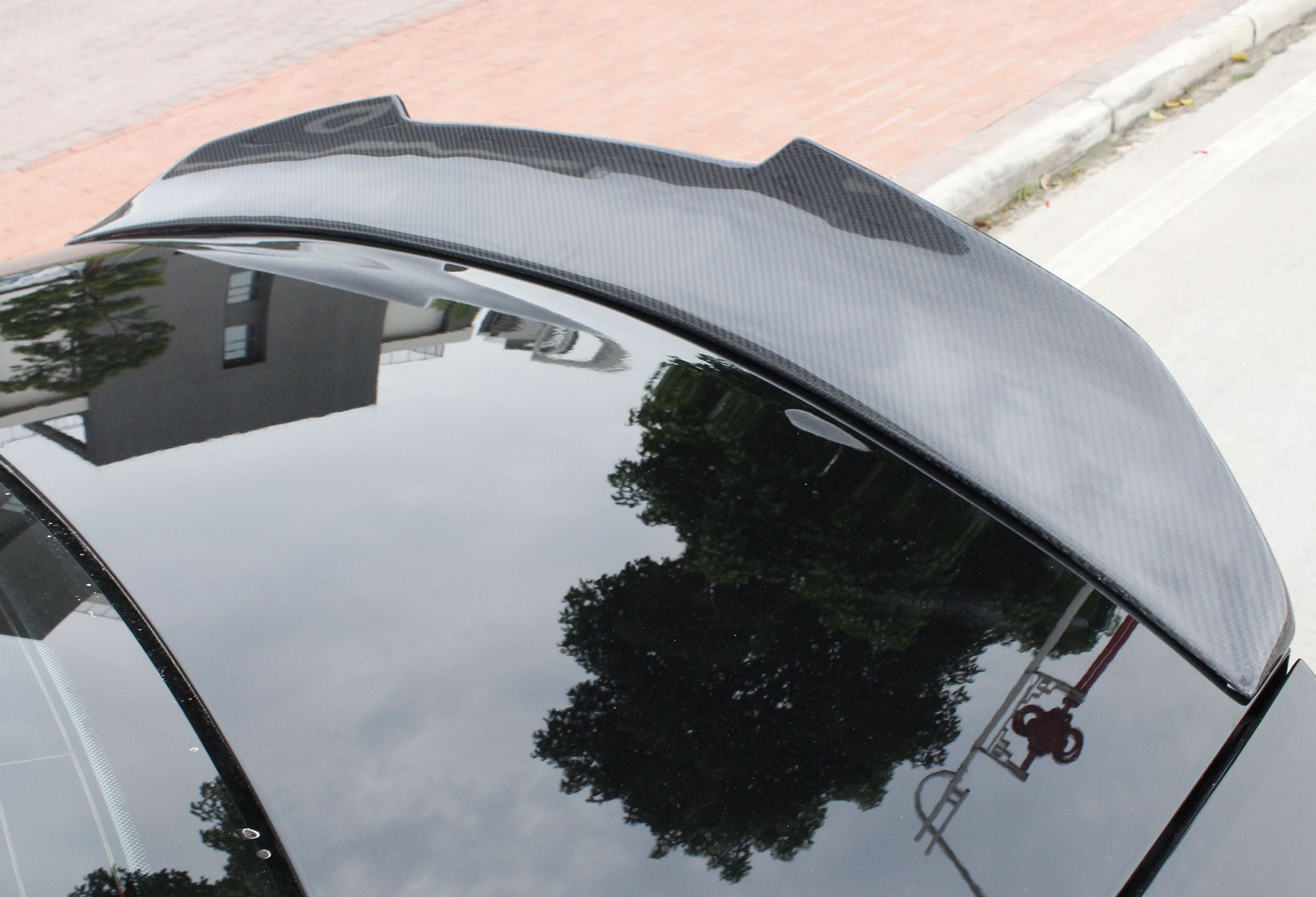 Pre-Preg Carbon fibre boot spoiler for Audi A3 S3 RS3 saloon, enhances sporty look and aerodynamics.