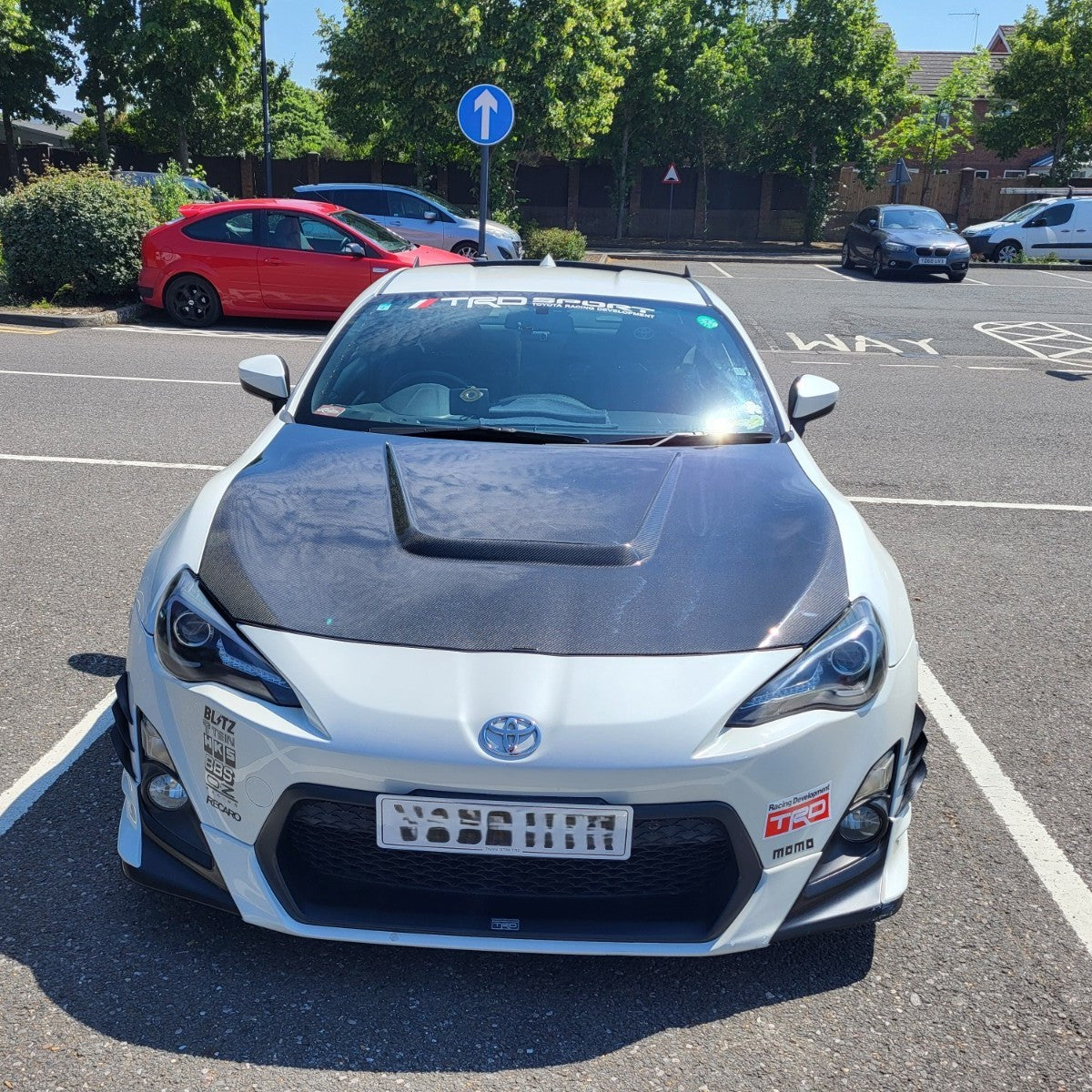 Carbon Fibre bonnet for Toyota GT86 2012-2020, exterior trim part with a sleek, textured finish, designed for sporty aesthetics.
